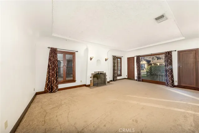 a view of a livingroom with furniture and a window