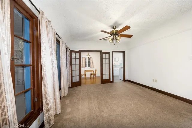 a view of a livingroom with a ceiling fan and a ceiling fan