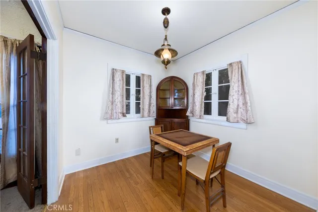 a bedroom with bunk bed and a window