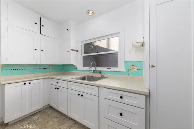 a bathroom with a sink and mirror