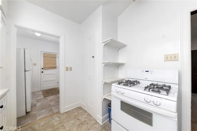 a kitchen with cabinets and appliances