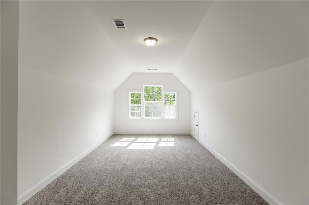 1210 Austin Road Winder, GA 30680 - Photo 45 of 56 an empty room with windows