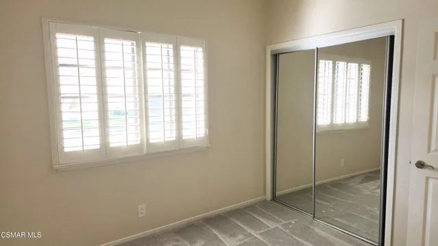 a bathroom with a toilet sink and vanity