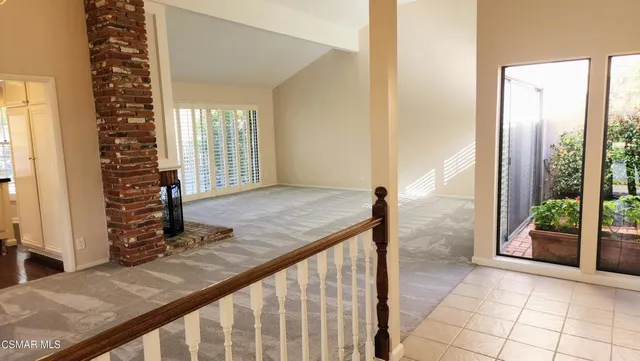a view of a living room and window