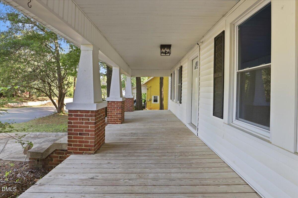 511 South Pine Street Spring Hope, NC 27882 - Photo 4 of 32 a front view of a house with a garden