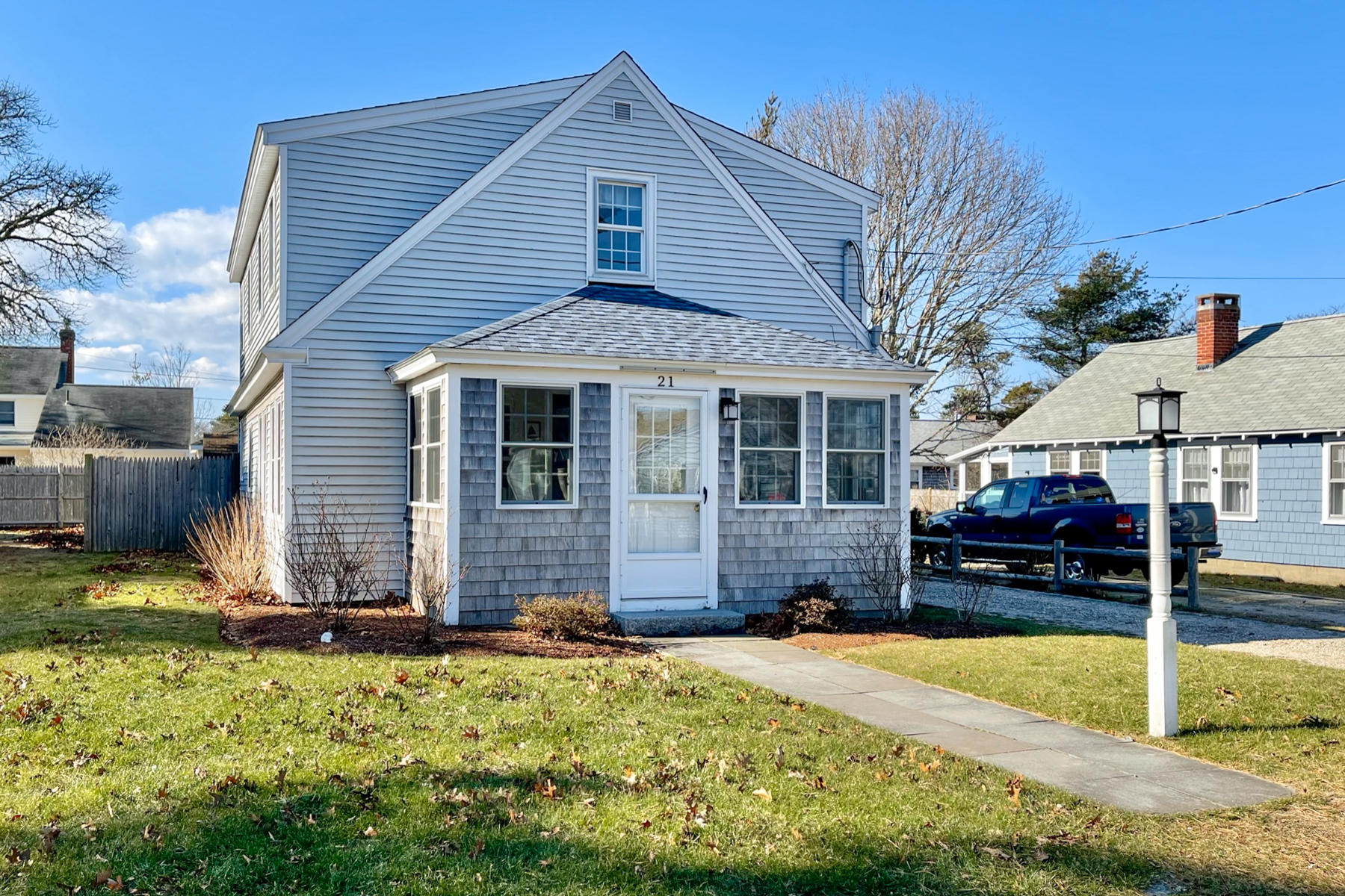 21 Carr Road Dennis Port, MA 02639 - Photo 1 of 33 a front view of a house with a yard