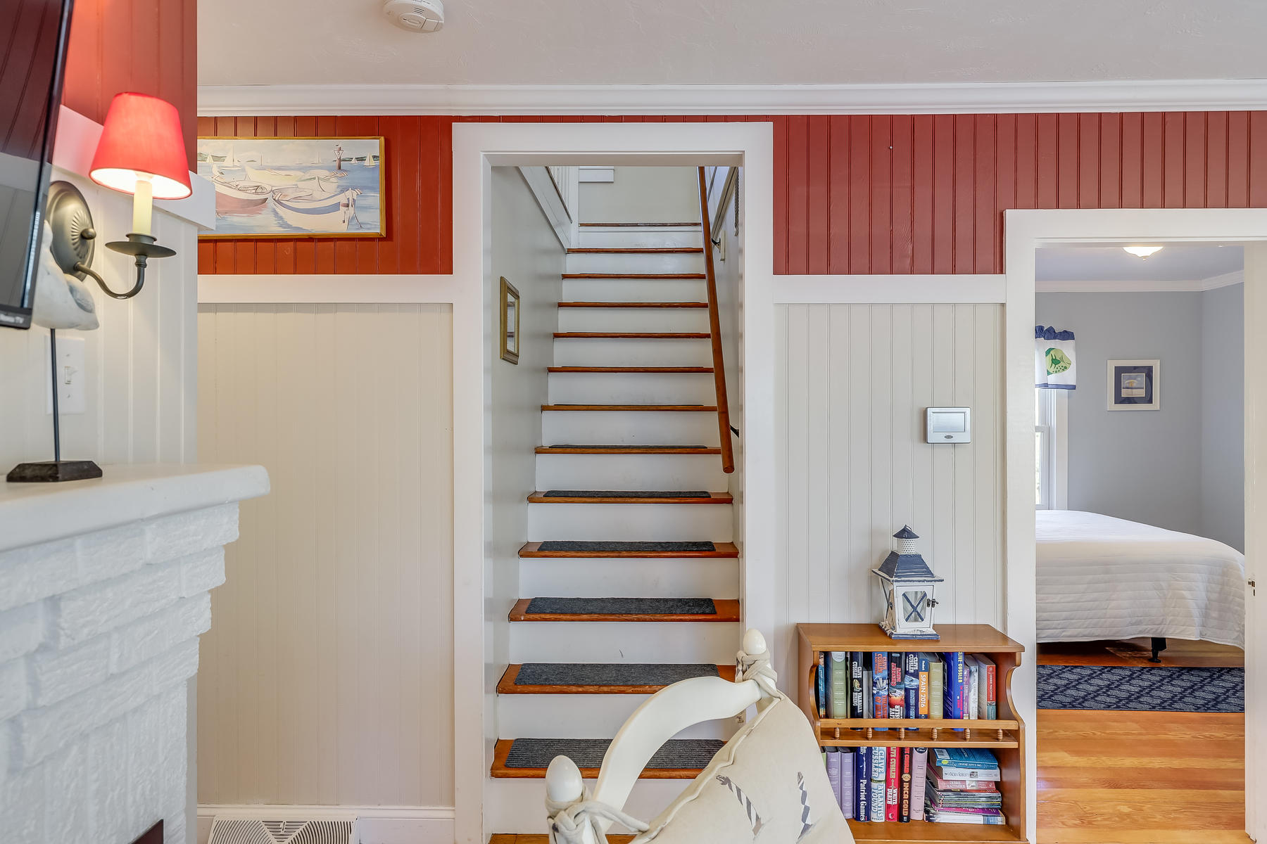 21 Carr Road Dennis Port, MA 02639 - Photo 16 of 33 a room with a book shelf and a painting on the wall
