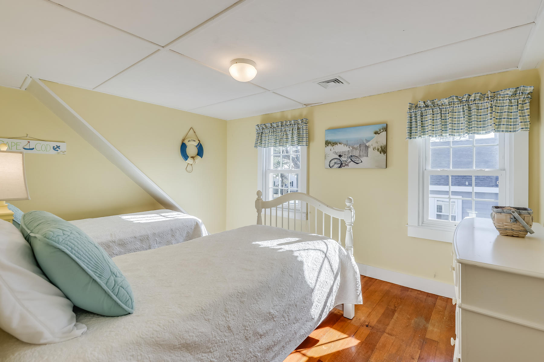 21 Carr Road Dennis Port, MA 02639 - Photo 19 of 33 a bedroom with a bed and wooden floor
