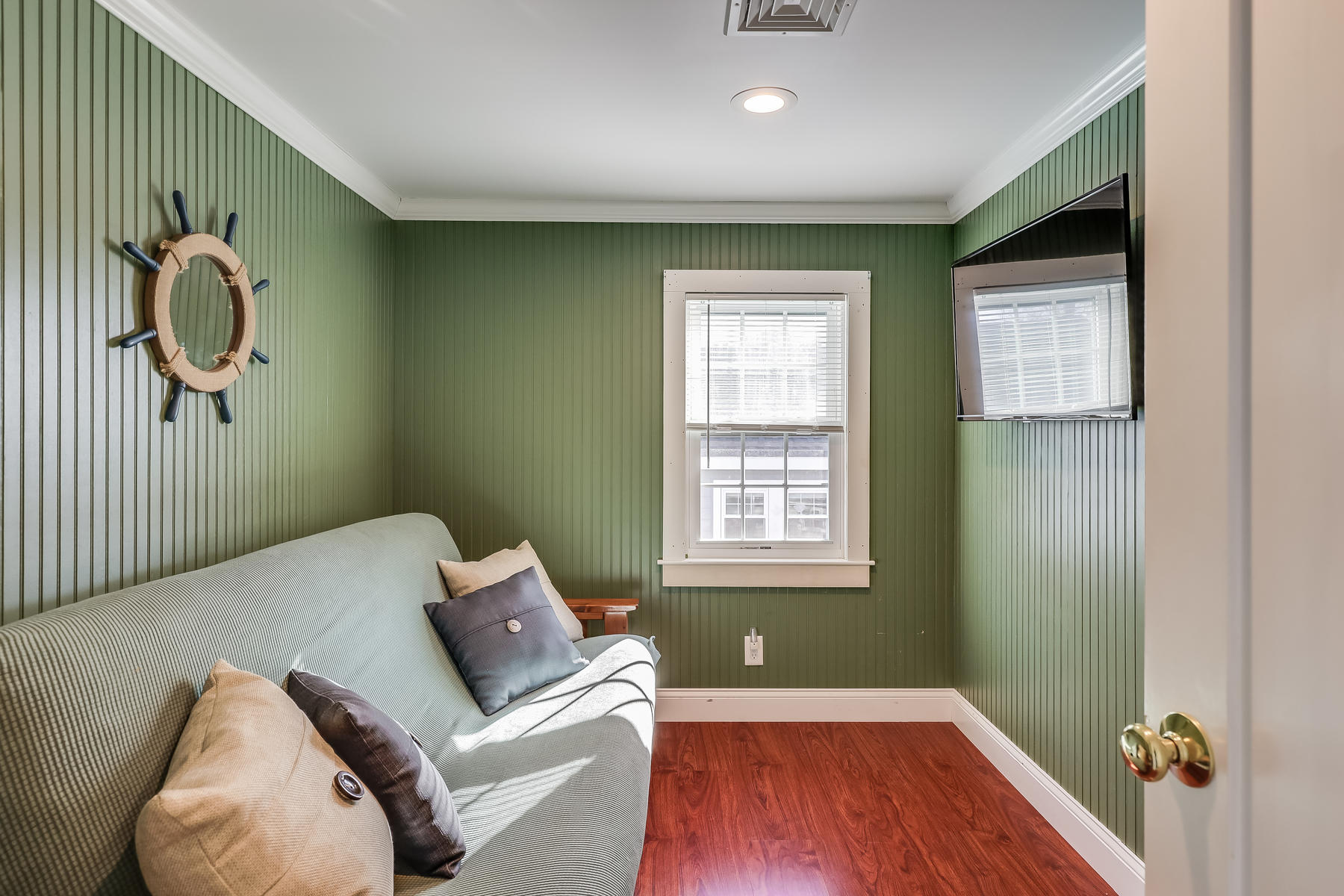 21 Carr Road Dennis Port, MA 02639 - Photo 22 of 33 a bedroom with a bed and wooden floor