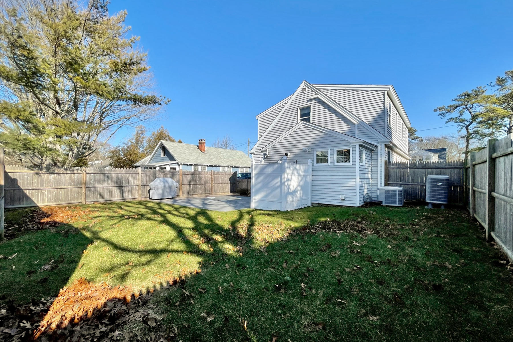 21 Carr Road Dennis Port, MA 02639 - Photo 27 of 33 a view of a house with a big yard and large trees