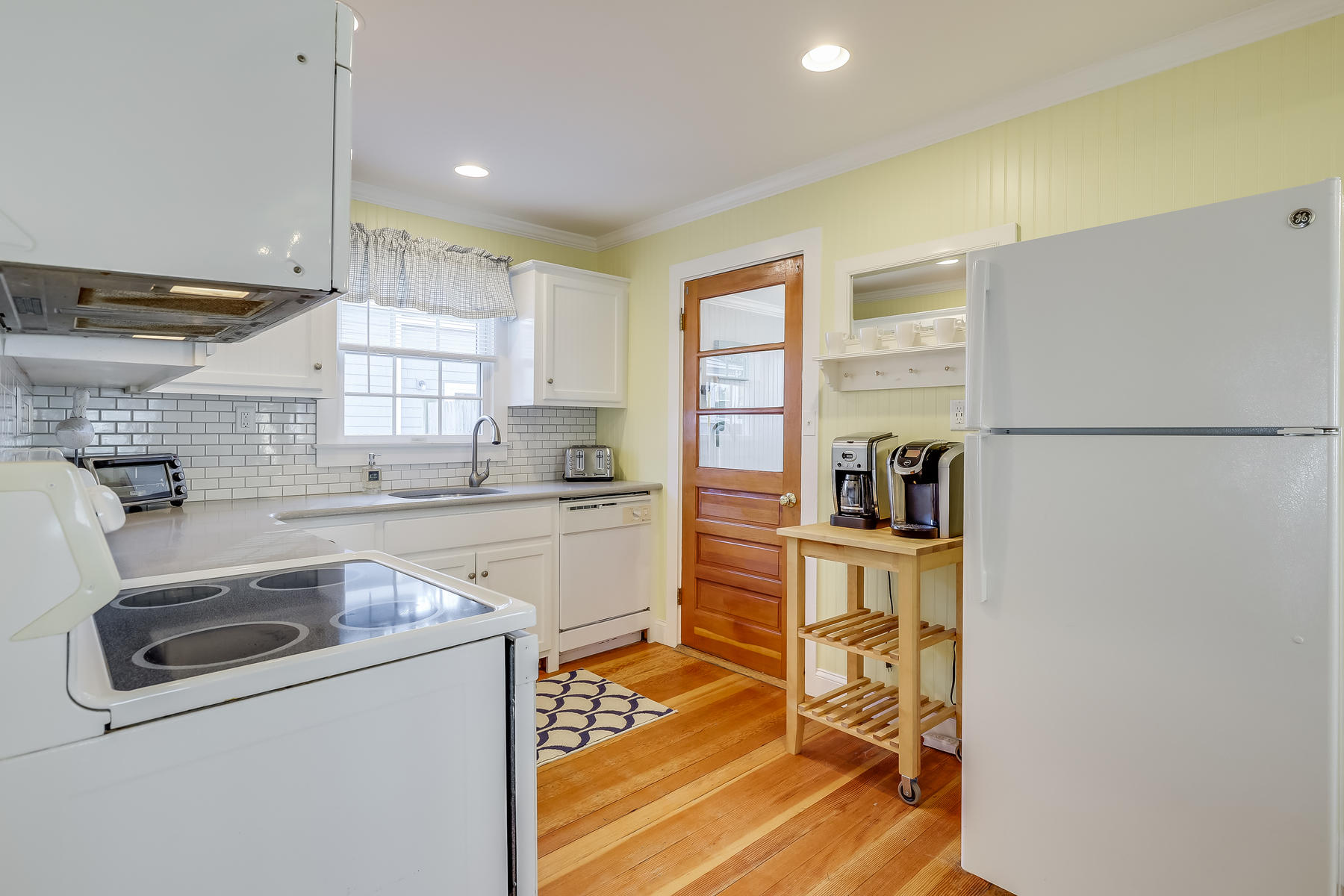 21 Carr Road Dennis Port, MA 02639 - Photo 8 of 33 a kitchen with cabinets and a stove top oven