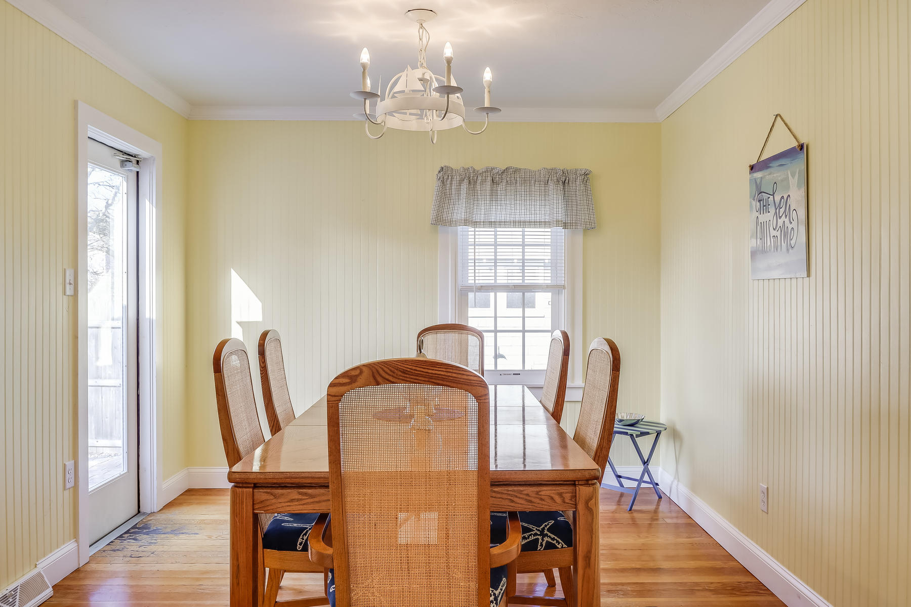 21 Carr Road Dennis Port, MA 02639 - Photo 9 of 33 a view of a dining room with furniture and wooden floor