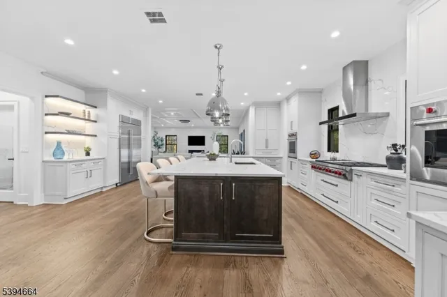 a kitchen with a table and chairs in it