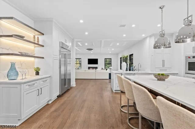 a kitchen with stainless steel appliances cabinets and a window