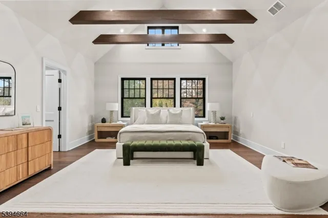 a bedroom with furniture and window