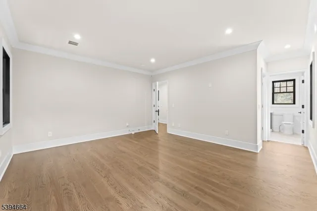 a kitchen with granite countertop a sink stainless steel appliances and cabinets