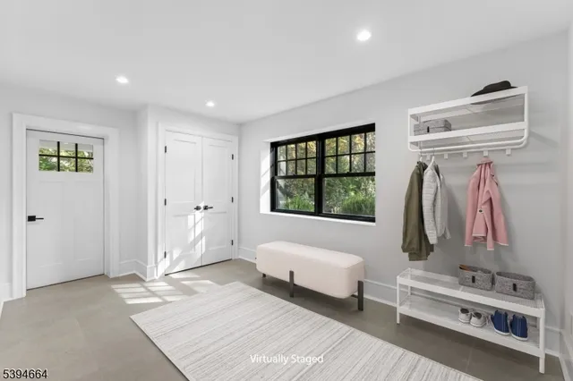 a view of a big yard with plants and large trees