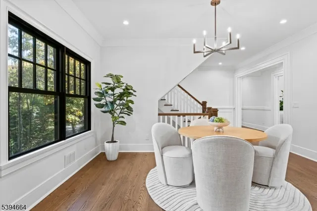 a living room with furniture a window and kitchen view