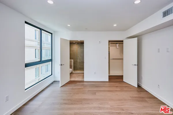 a view of an entryway with wooden floor
