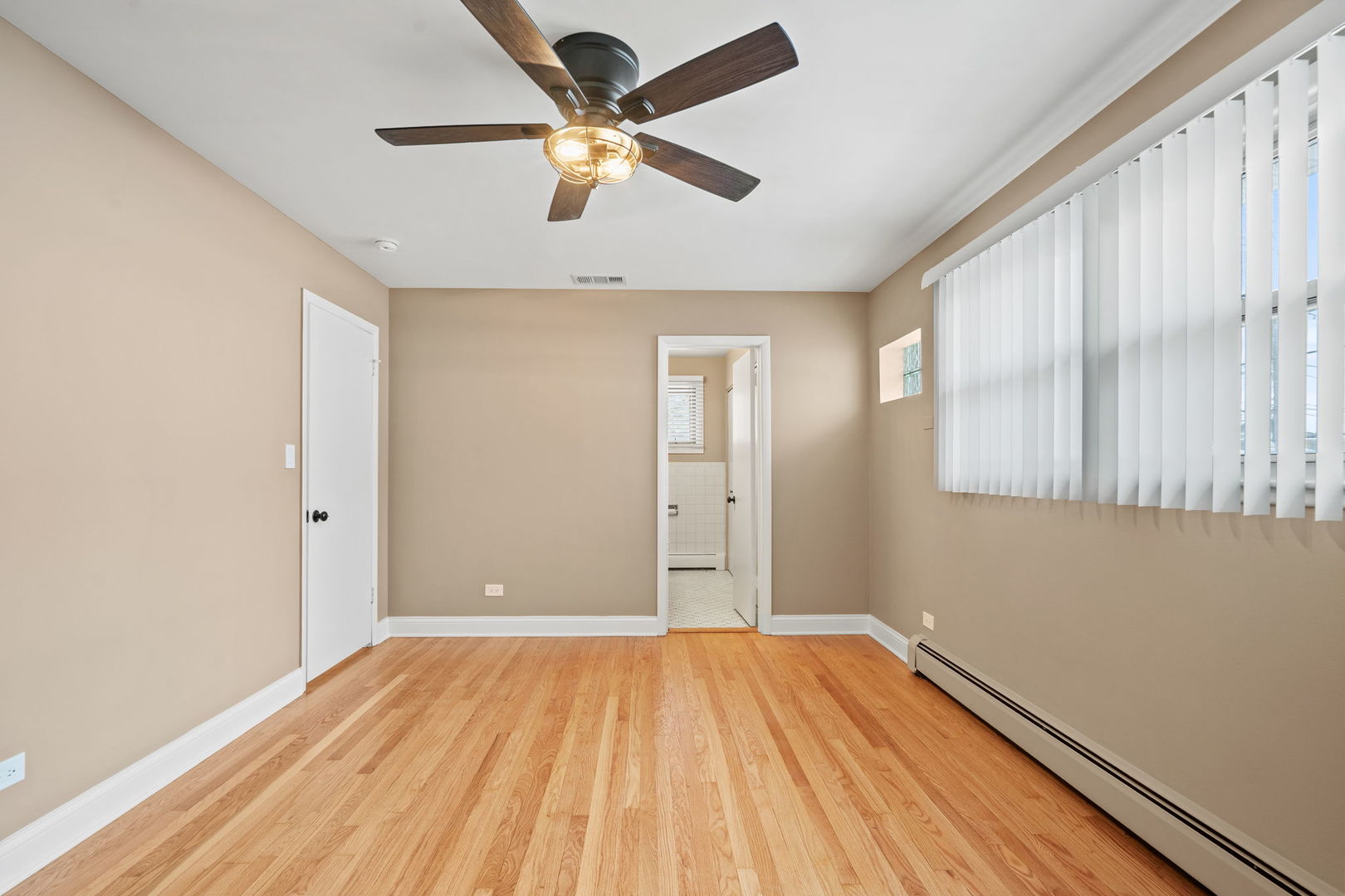 2737 Spruce Street River Grove, IL 60171 - Photo 11 of 20 wooden floor in an empty room with a window