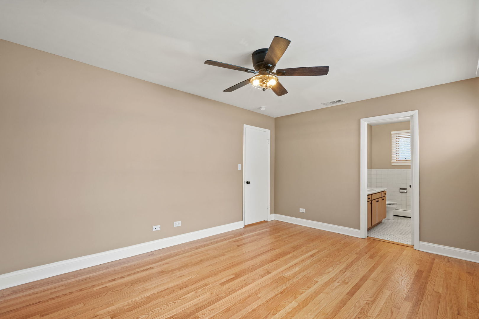 2737 Spruce Street River Grove, IL 60171 - Photo 12 of 20 a view of empty room with wooden floor and fan