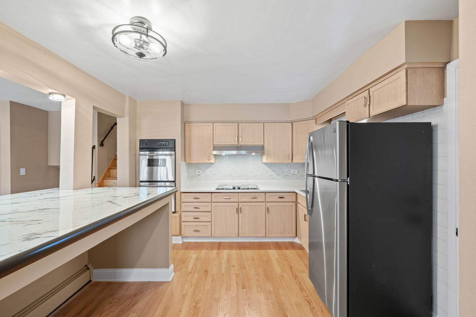 2737 Spruce Street River Grove, IL 60171 - Photo 8 of 20 a kitchen with stainless steel appliances granite countertop a refrigerator a stove and a sink