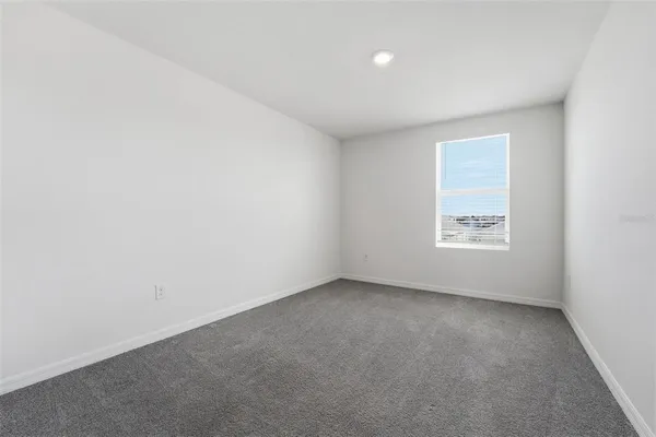 a view of an empty room and closet