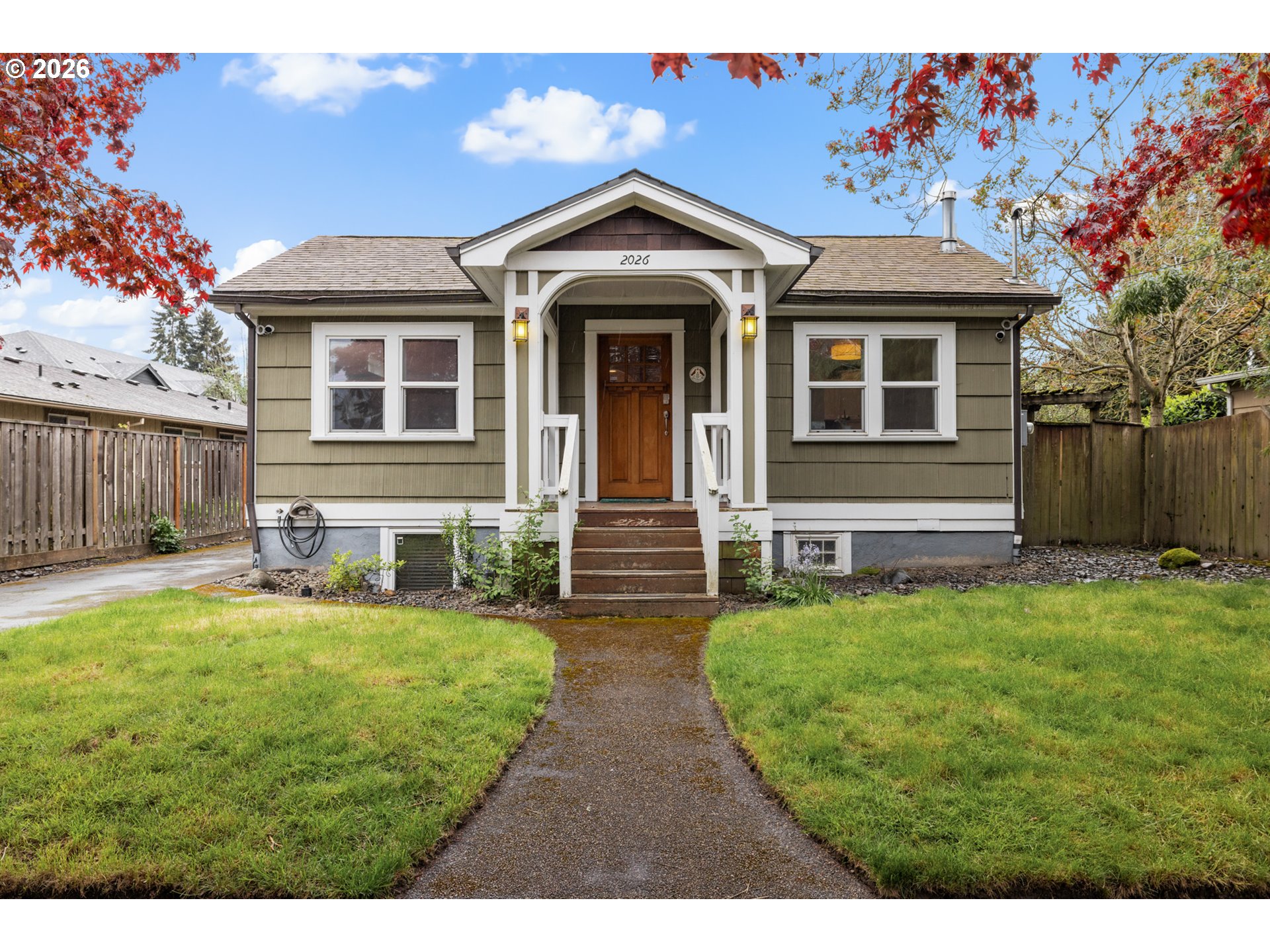 2026 Southeast Insley Street Portland, OR 97202 - Photo 1 of 32 a front view of a house with a yard