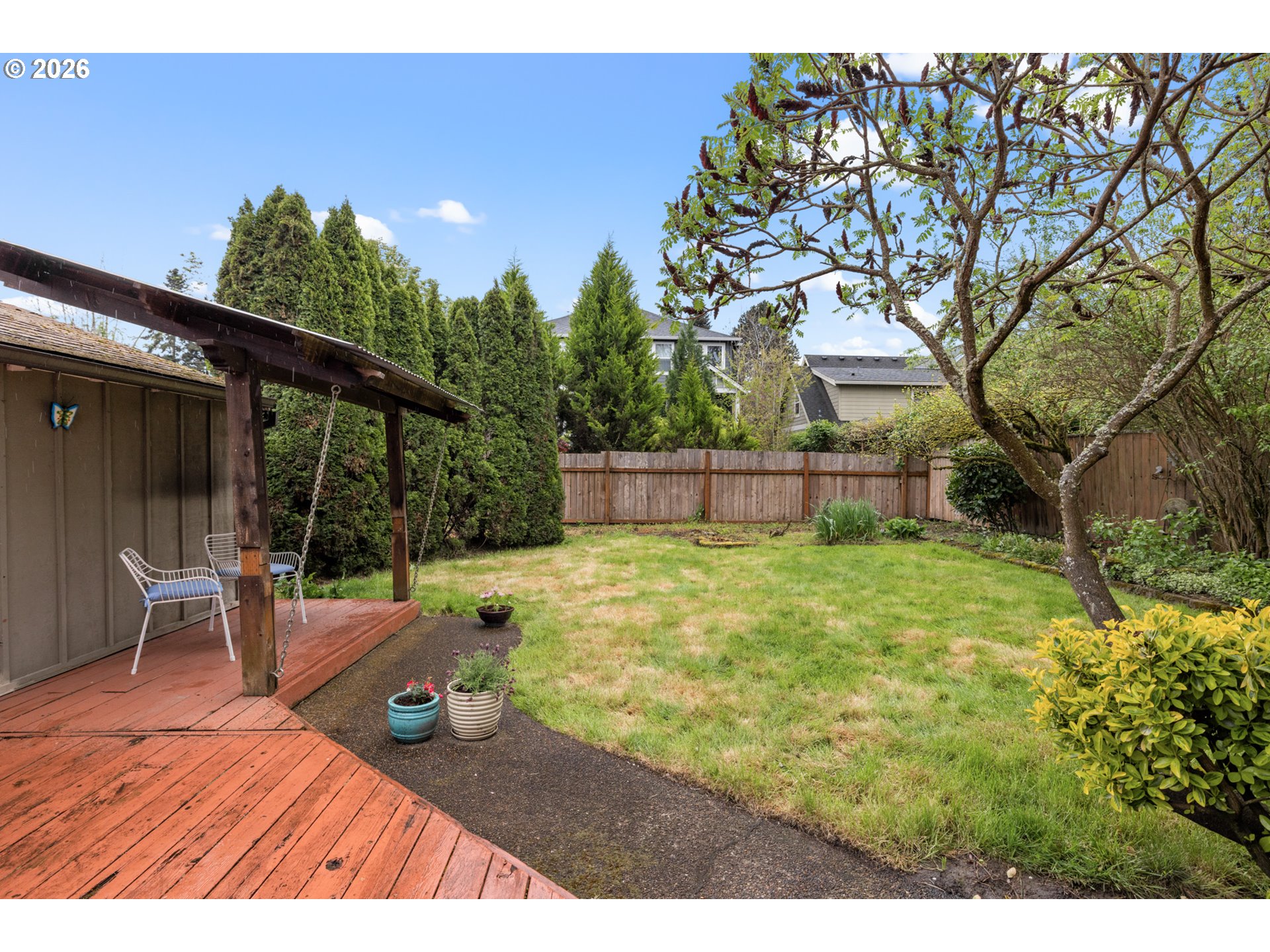 2026 Southeast Insley Street Portland, OR 97202 - Photo 28 of 32 a backyard of a house with table and chairs