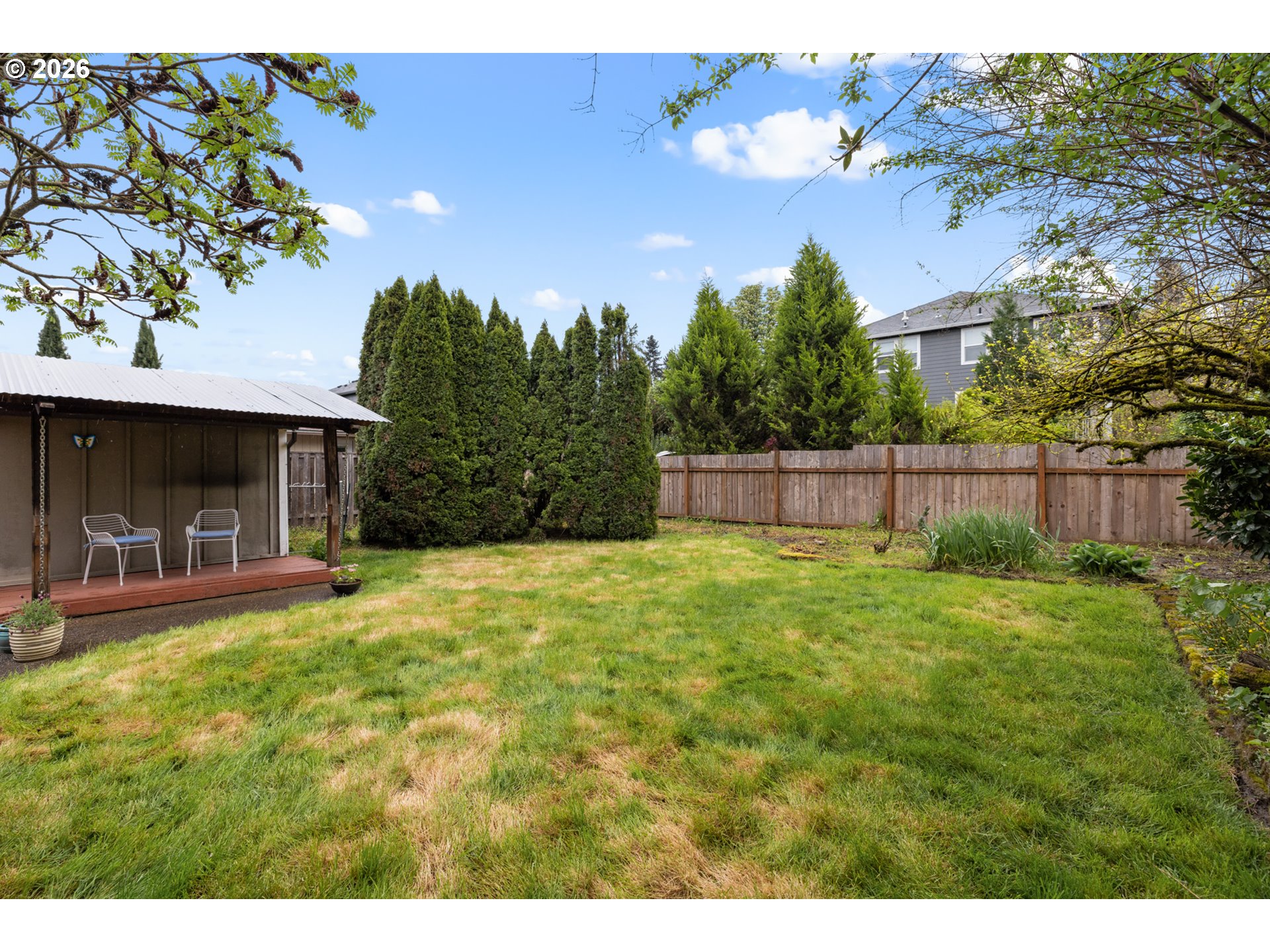 2026 Southeast Insley Street Portland, OR 97202 - Photo 29 of 32 a view of a backyard with plants and a garden
