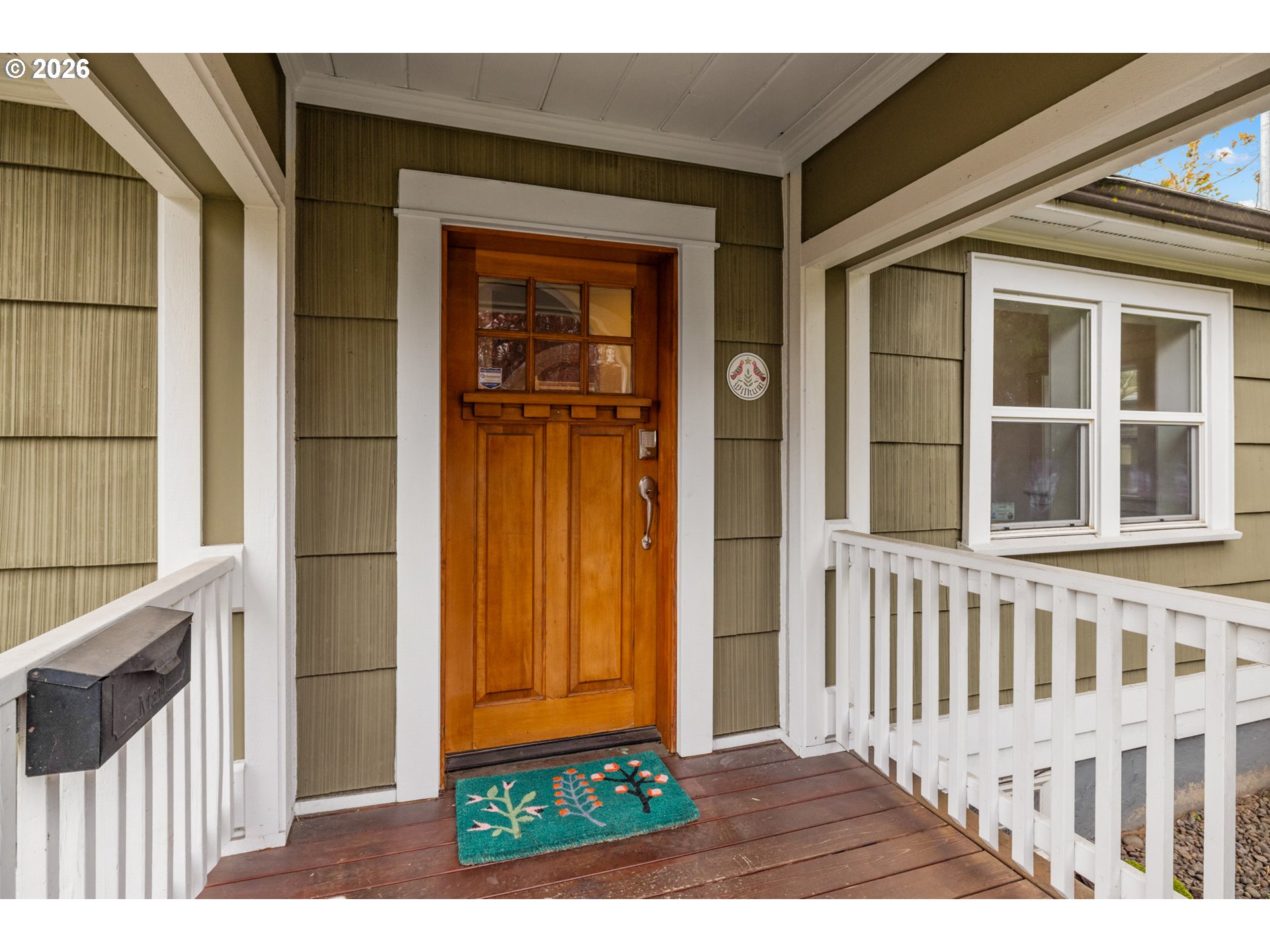 2026 Southeast Insley Street Portland, OR 97202 - Photo 3 of 32 a front view of a house with a porch