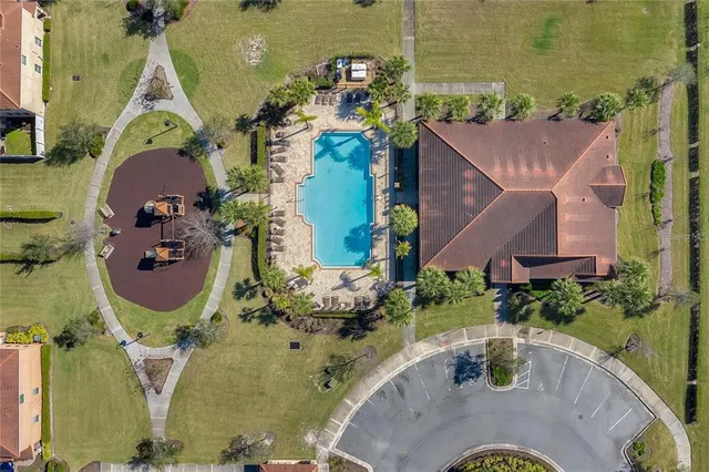 an aerial view of a house with outdoor space