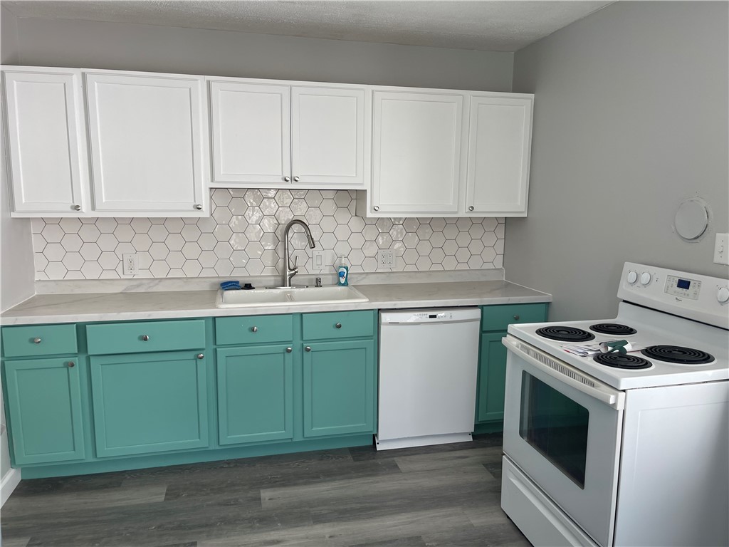 1361 Sussex Road Troy, OH 45373 - Photo 18 of 25 This modern kitchen features stylish cabinetry and essential appliances for comfortable living.