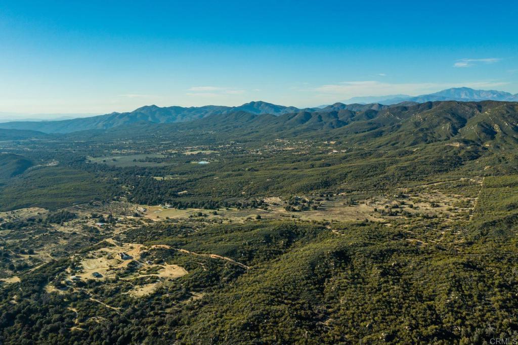 0 Chihuahua Valley Road Warner Springs, CA 92086 - Photo 3 of 7 a view of a lush green forest with mountains in the background