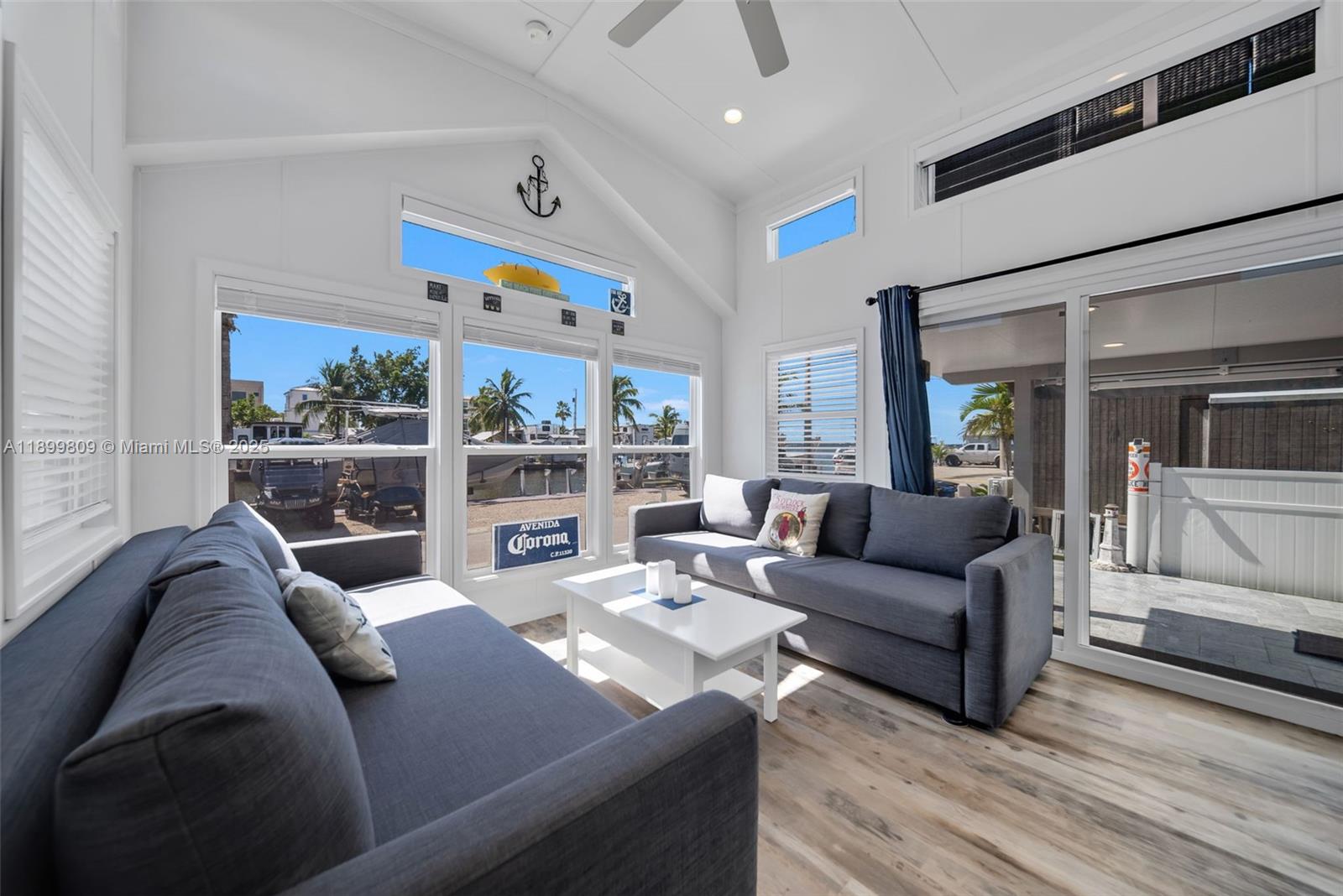 325 Calusa Street Key Largo, FL 33037 - Photo 16 of 26 a living room with furniture and a window