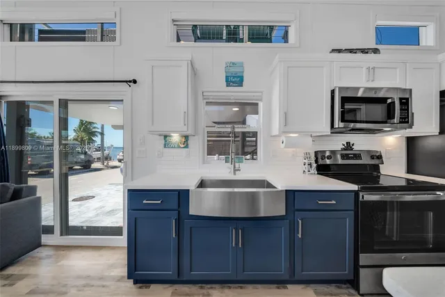 a view of a patio with a table and chairs
