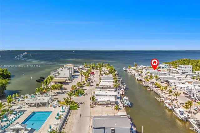 a view of a balcony with chairs and wooden floor