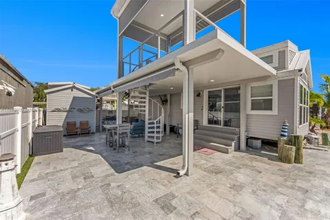 a living room with fireplace furniture and a large window
