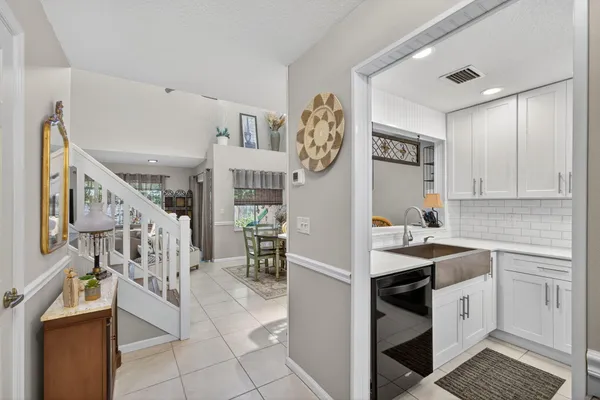 a kitchen with a sink and a stove top oven