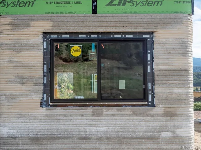 a view of a entryway door of the house and front yard