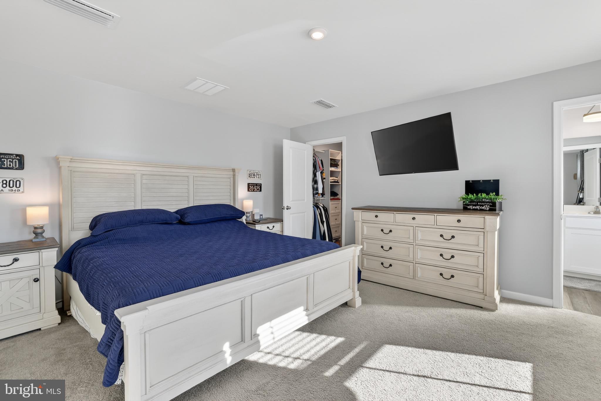 7069 Wise Lane King George, VA 22485 - Photo 14 of 39 Serene bedroom with modern elegance.