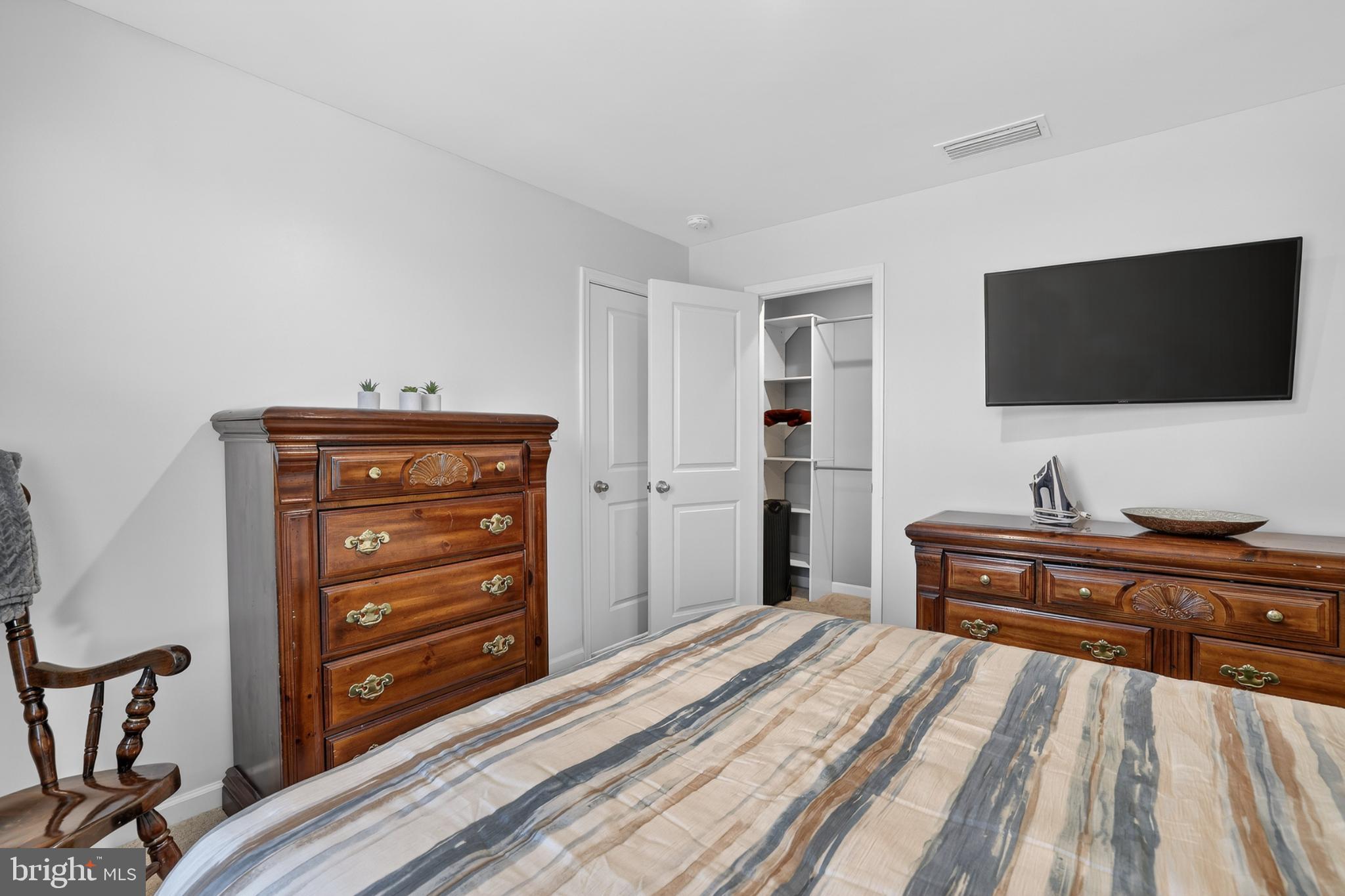 7069 Wise Lane King George, VA 22485 - Photo 23 of 39 Cozy bedroom with classic wooden accents.