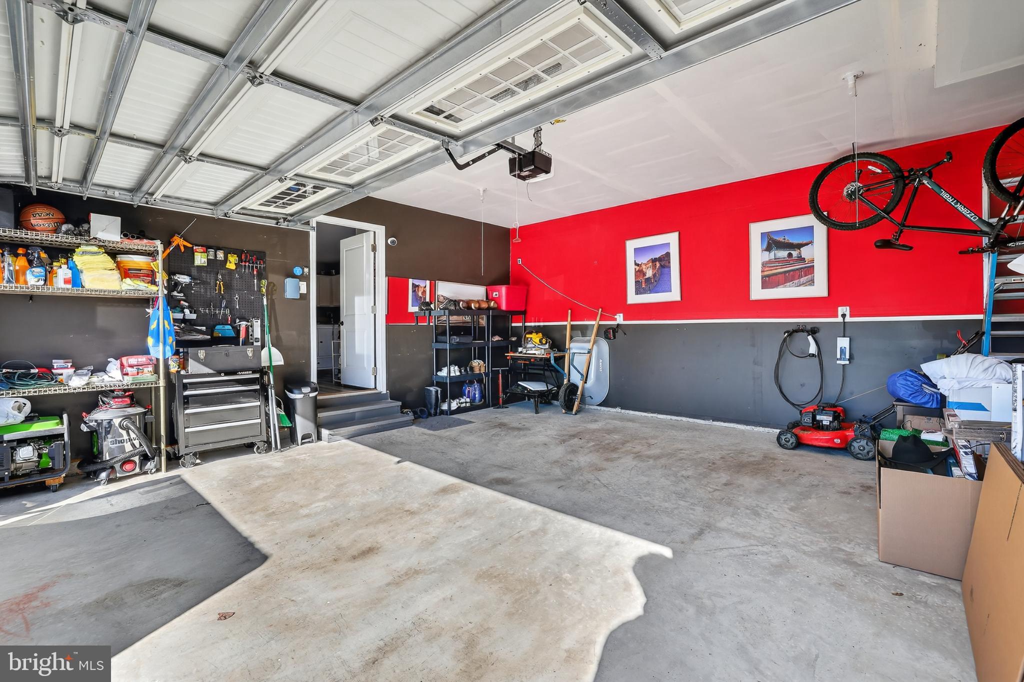 7069 Wise Lane King George, VA 22485 - Photo 32 of 39 Spacious garage with vibrant red accents.
