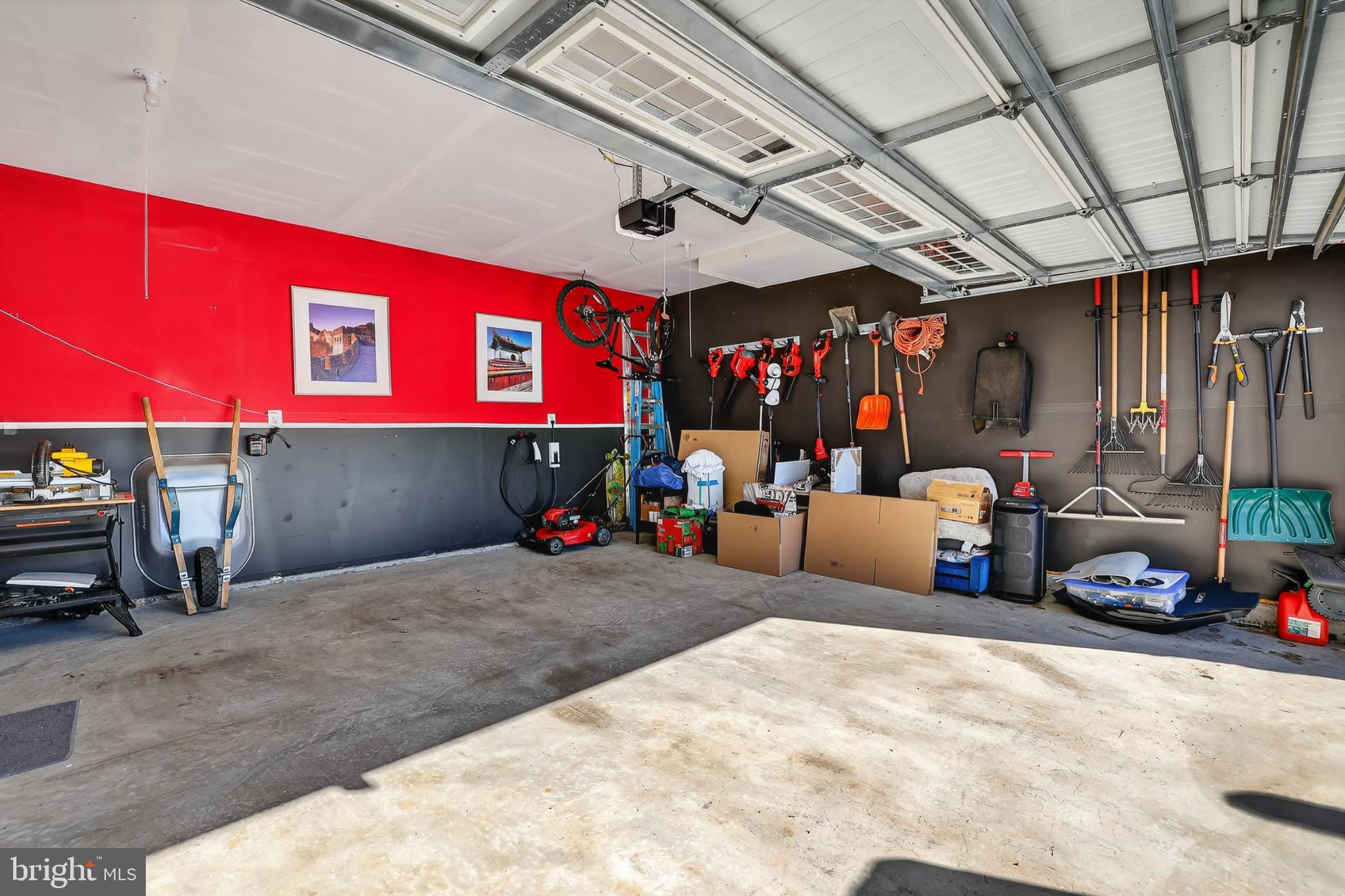 7069 Wise Lane King George, VA 22485 - Photo 33 of 39 Vibrant garage with organized tools and gear.