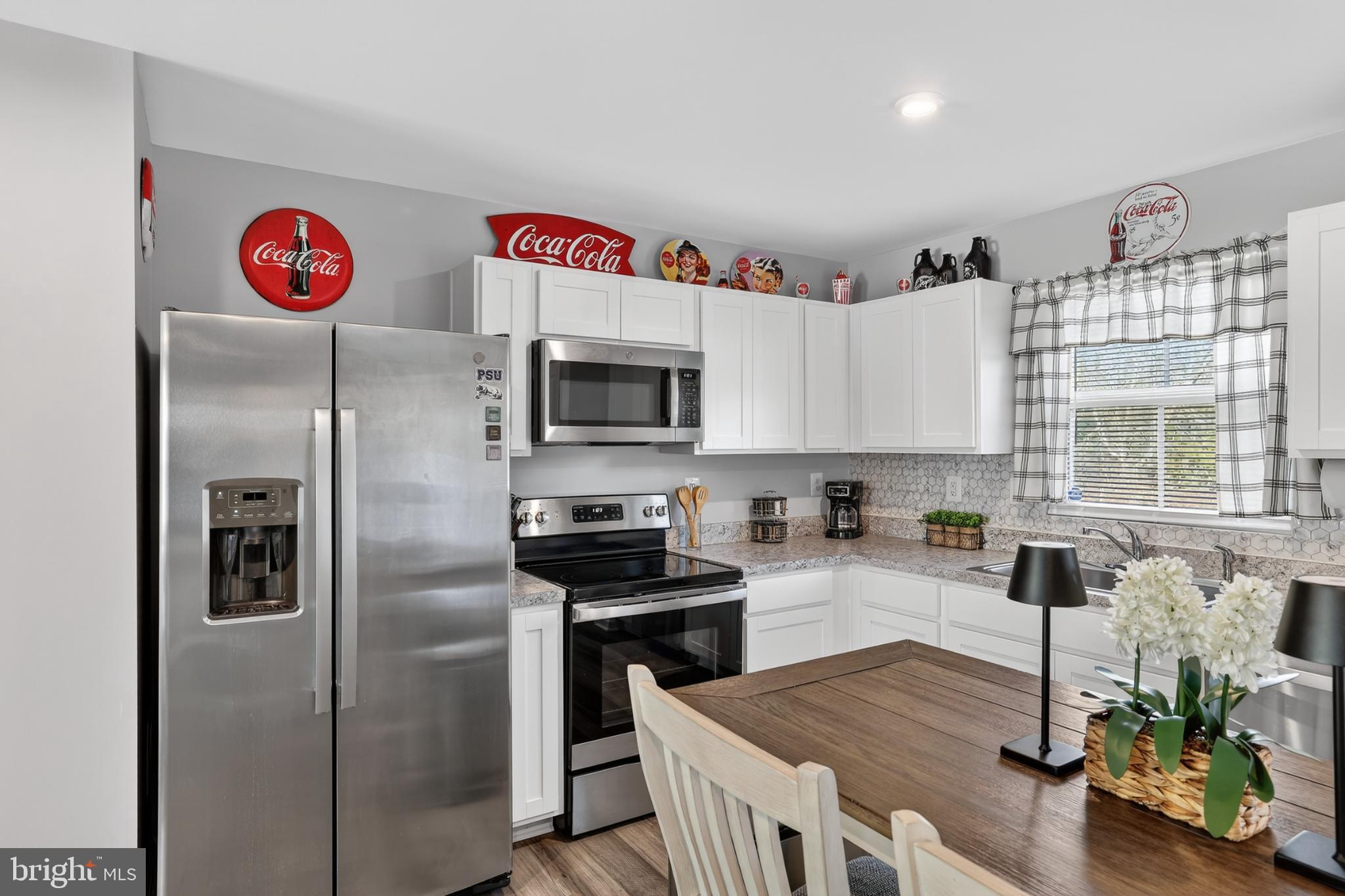 7069 Wise Lane King George, VA 22485 - Photo 9 of 39 Charming kitchen with vintage Coca-Cola decor.