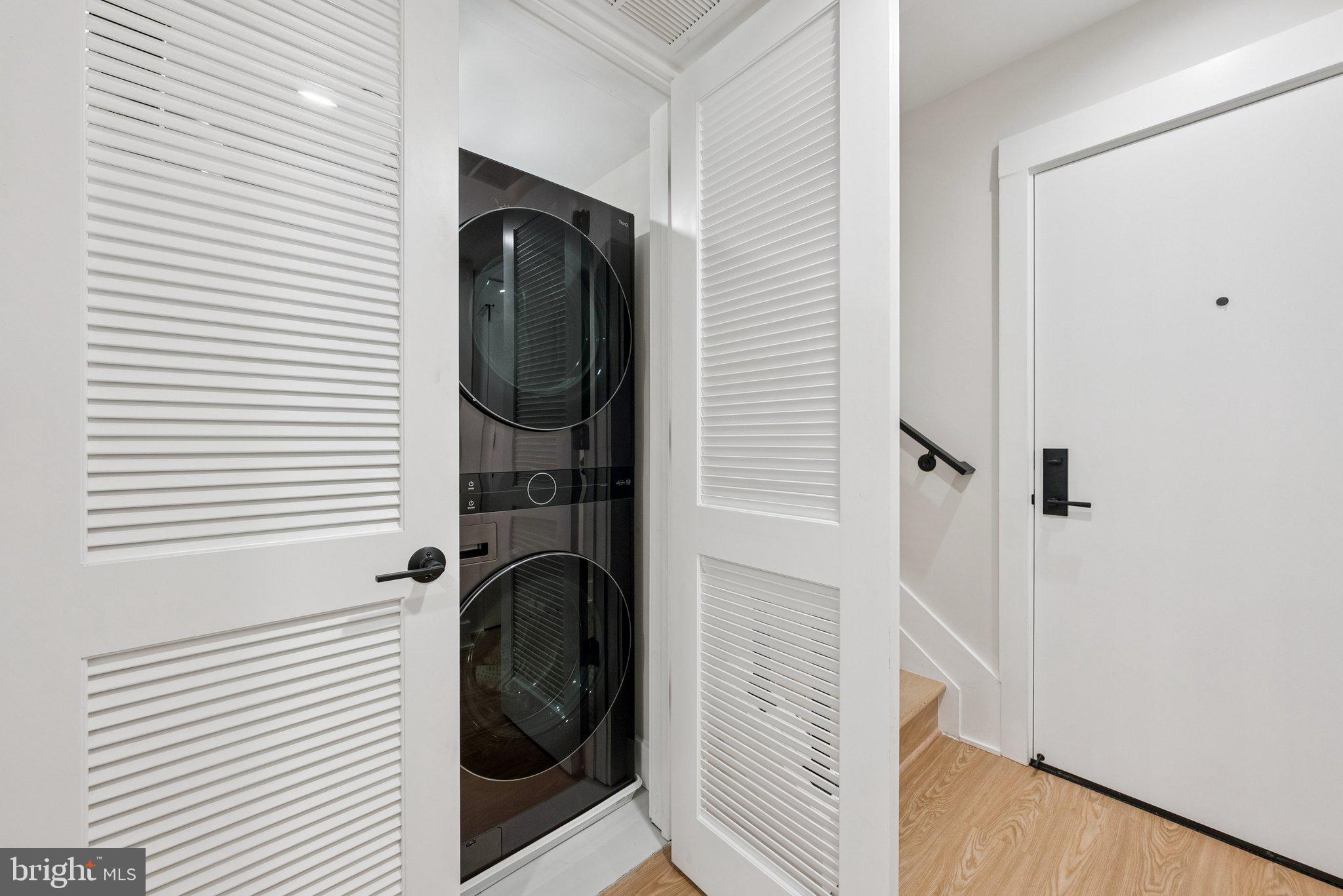 2134 Wisconsin Avenue Northwest, Unit 6 Washington, DC 20007 - Photo 12 of 43 a view of a storage & utility room with washer and dryer