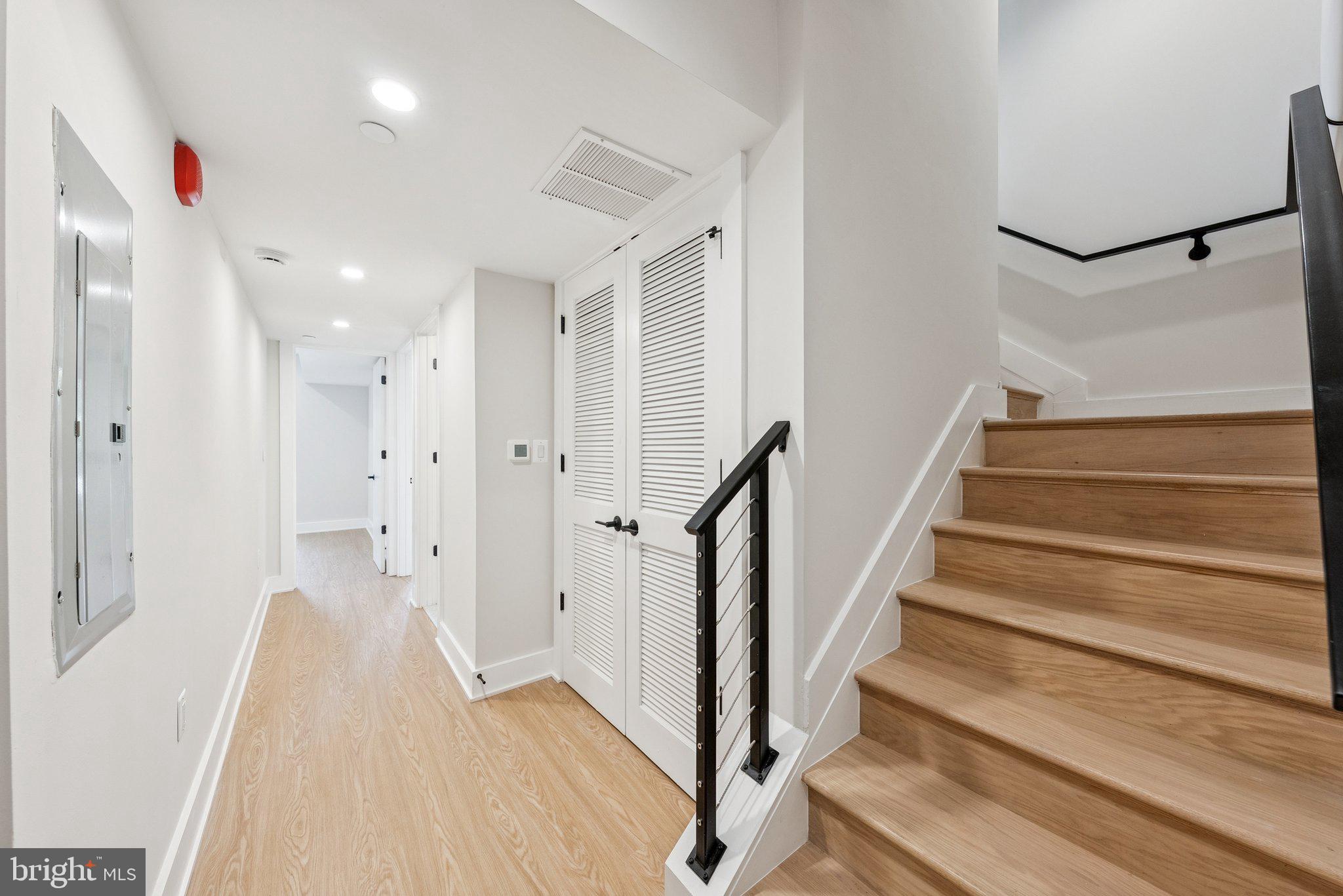 2134 Wisconsin Avenue Northwest, Unit 6 Washington, DC 20007 - Photo 13 of 43 a view of a hallway with wooden floor and entryway