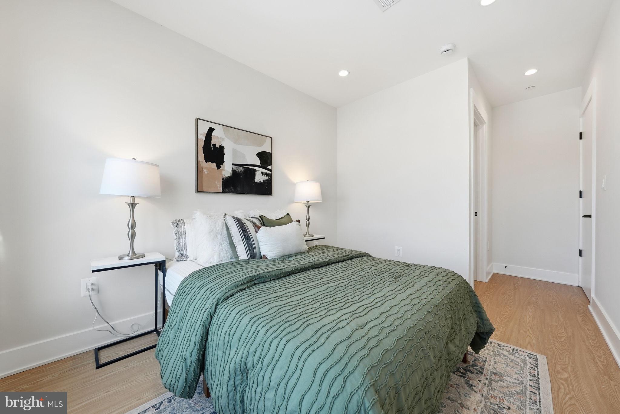 2134 Wisconsin Avenue Northwest, Unit 6 Washington, DC 20007 - Photo 15 of 43 a bedroom with a bed and a night stand