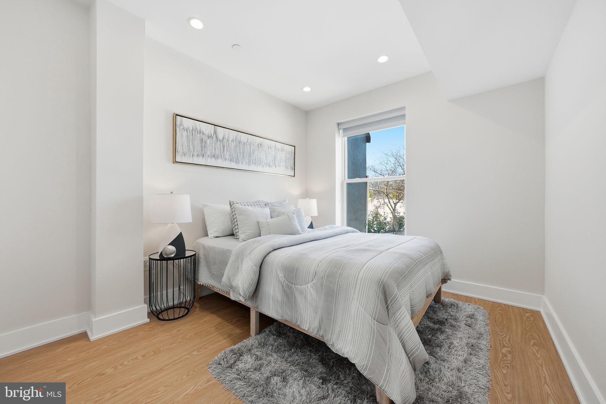 2134 Wisconsin Avenue Northwest, Unit 6 Washington, DC 20007 - Photo 20 of 43 a spacious bedroom with a bed and a window