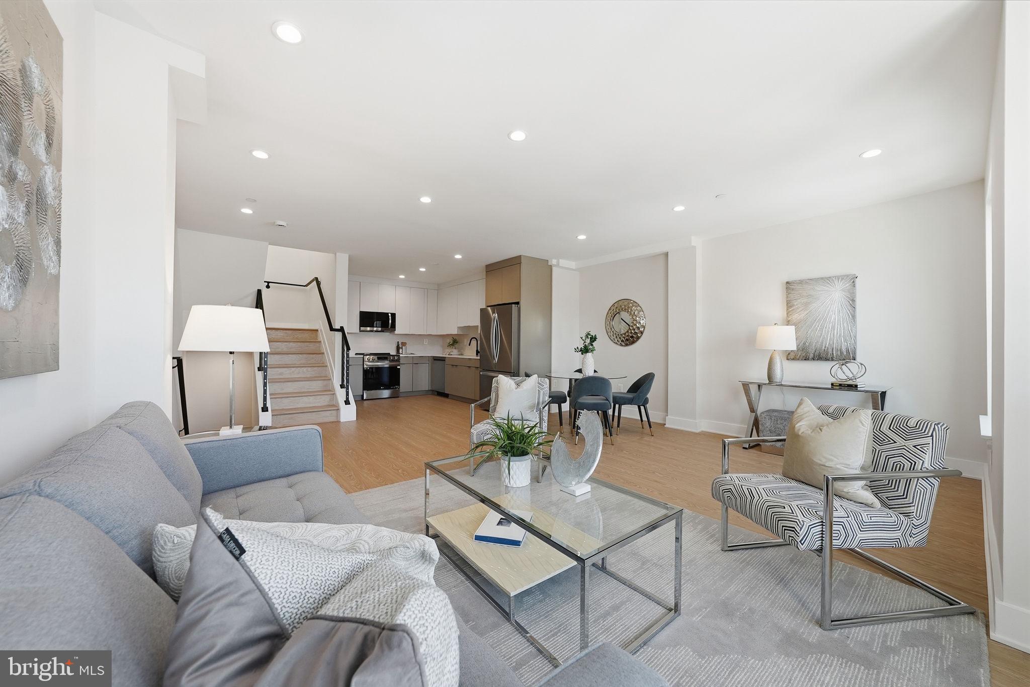 2134 Wisconsin Avenue Northwest, Unit 6 Washington, DC 20007 - Photo 2 of 43 a living room with furniture kitchen view and a table